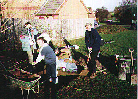 Roy Campsall, Lynne Atkinson and (LUSAD sculptor) Will Nossiter prepare a plinth for Will's work